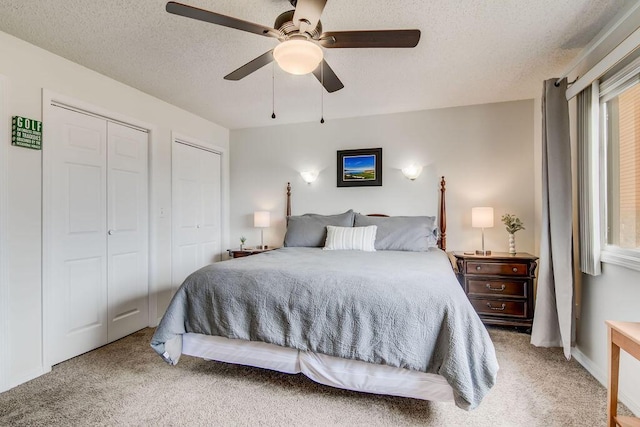 189 Avondale Dr Unit 91-6, Branson, MO 65616 - bedroom featuring carpet flooring, ceiling fan, a textured ceiling, and multiple closets