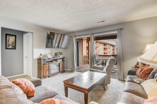 189 Avondale Dr Unit 91-6, Branson, MO 65616 - carpeted living room featuring a textured ceiling