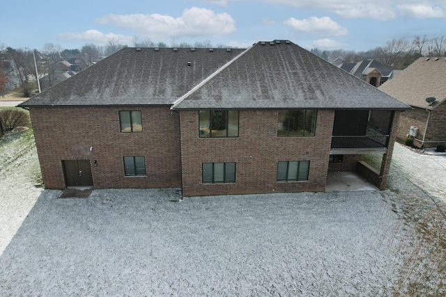 back of house with a sunroom