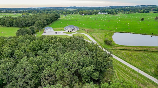 bird's eye view with a water view and a rural view