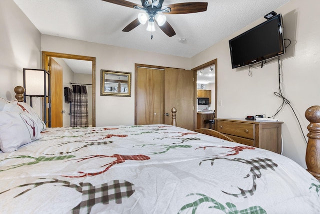 bedroom featuring a textured ceiling, ensuite bathroom, and ceiling fan