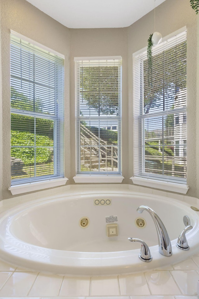 bathroom featuring a relaxing tiled tub