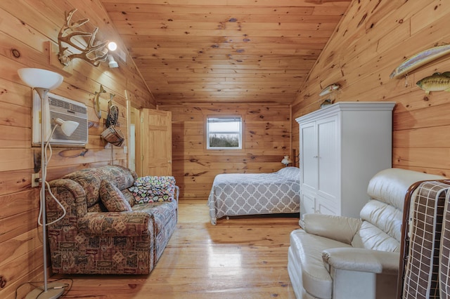 bedroom featuring light hardwood / wood-style flooring, wooden ceiling, and vaulted ceiling