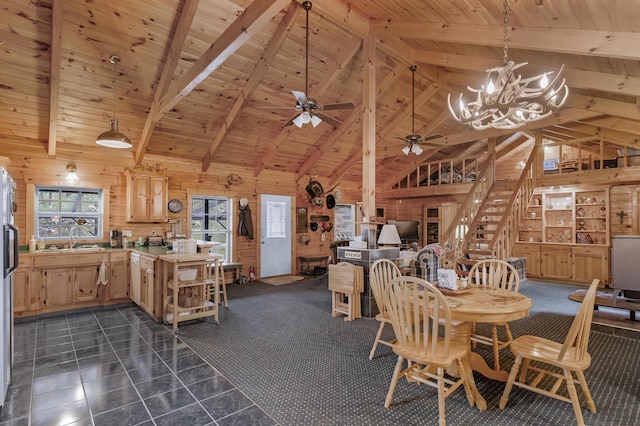 tiled dining space featuring wood walls, wooden ceiling, high vaulted ceiling, sink, and beamed ceiling