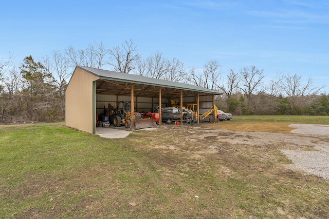 view of outbuilding featuring a yard