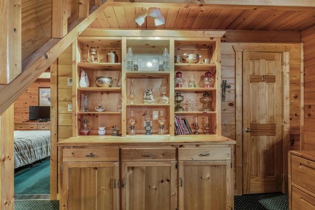 bar with wood walls and wooden ceiling