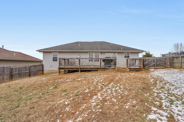 rear view of house featuring a deck