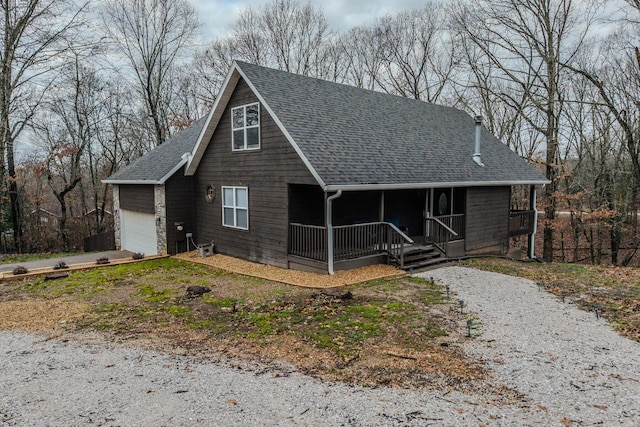 view of front of home featuring a porch and a garage