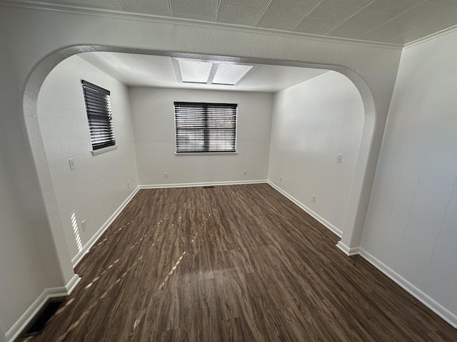 unfurnished room featuring dark wood-type flooring