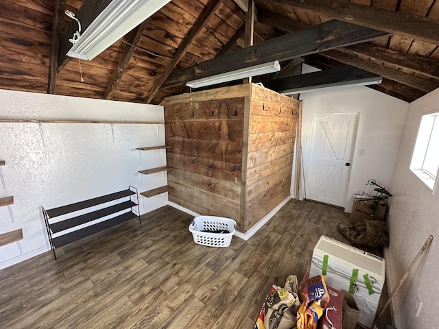 interior space with lofted ceiling with beams, dark wood-type flooring, and wood ceiling