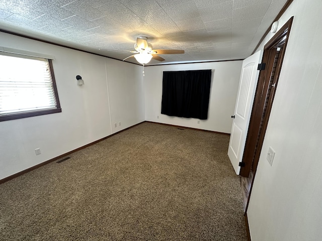 carpeted empty room with ceiling fan