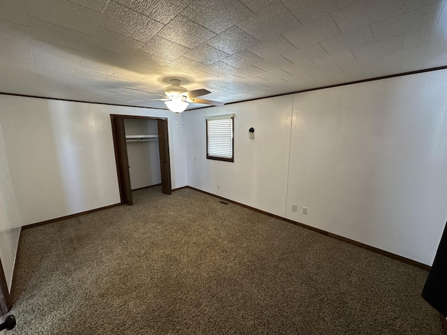 unfurnished bedroom featuring carpet and ceiling fan