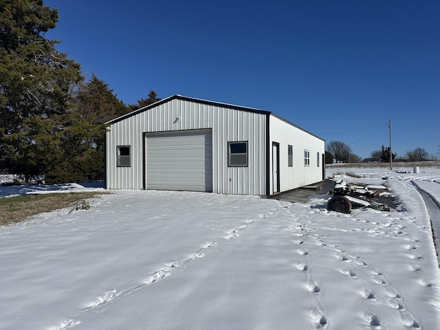 view of snow covered garage