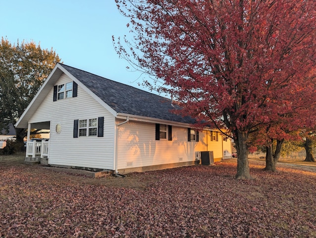 exterior space with a porch and cooling unit