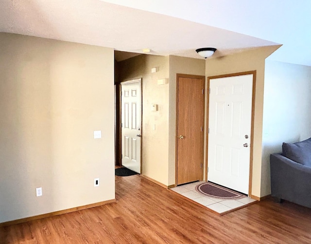 entryway with light hardwood / wood-style floors