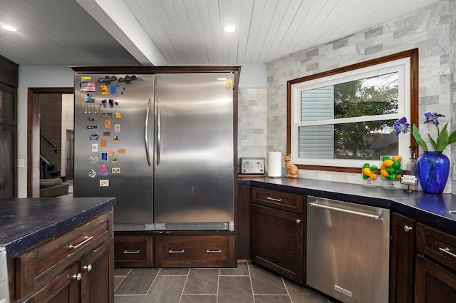 kitchen featuring stainless steel appliances and dark brown cabinets