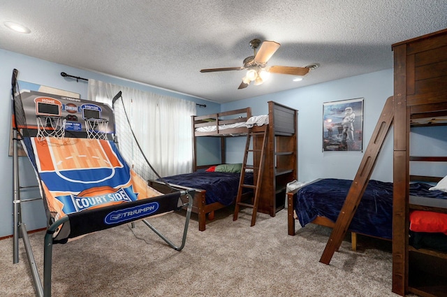 carpeted bedroom with ceiling fan and a textured ceiling