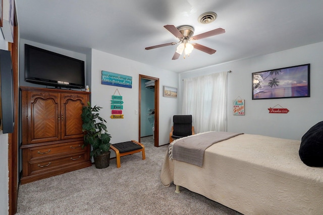 bedroom with light colored carpet and ceiling fan