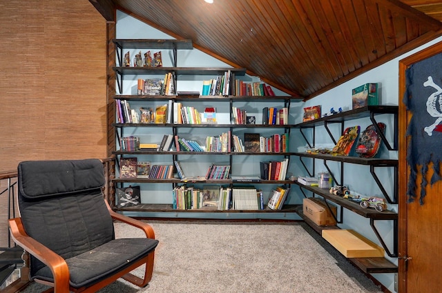 living area with lofted ceiling, carpet flooring, and wood ceiling