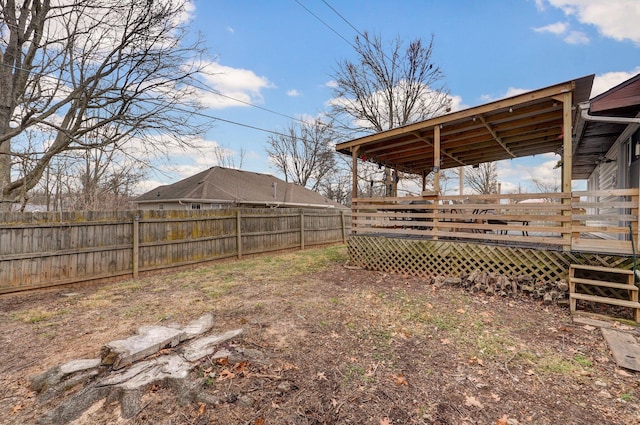 view of yard with a wooden deck