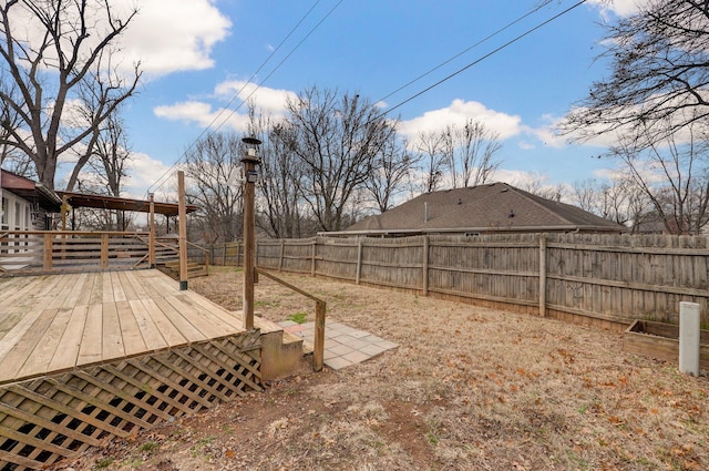 view of yard with a wooden deck