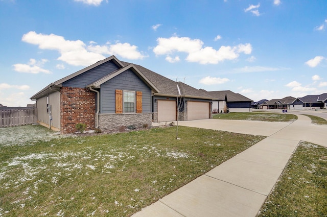 view of front of property featuring a garage and a front lawn