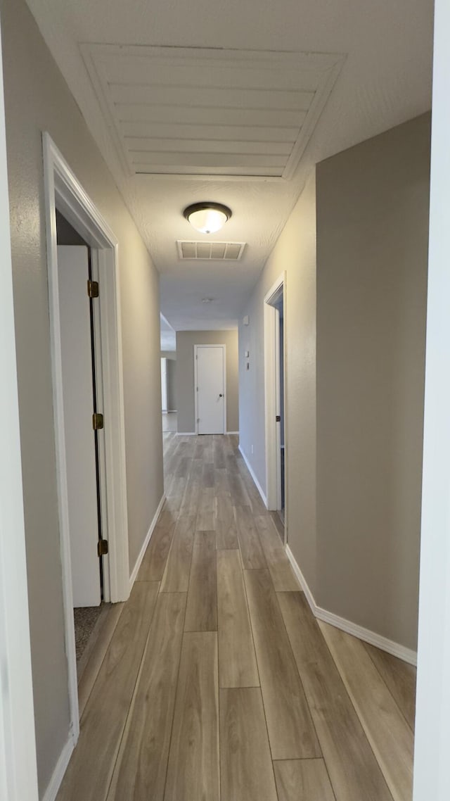 hall featuring light wood-type flooring