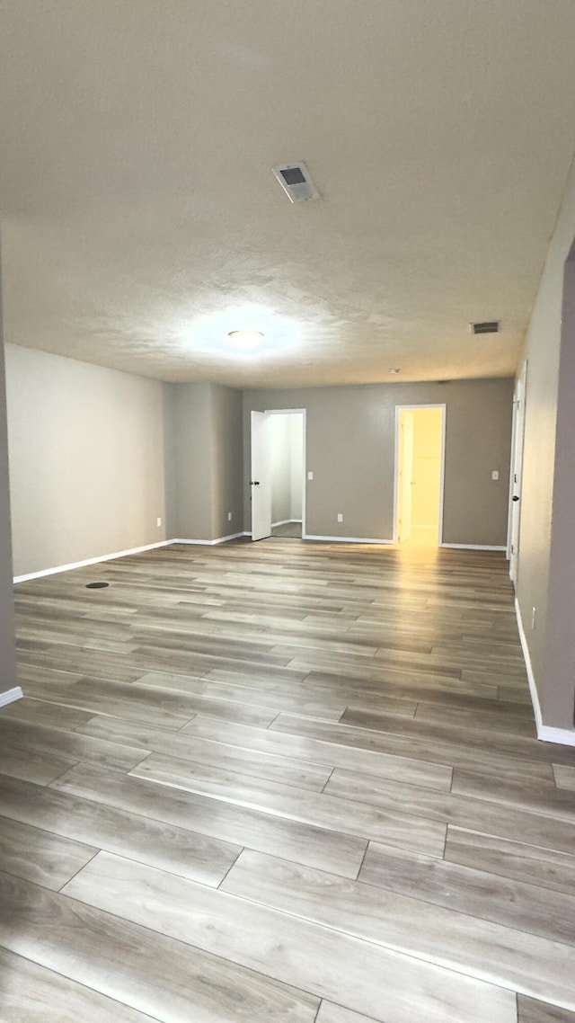 spare room featuring light hardwood / wood-style floors