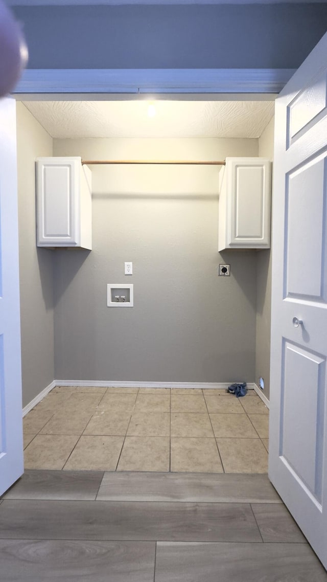 laundry room with cabinets and hookup for a washing machine