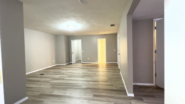 spare room with hardwood / wood-style flooring