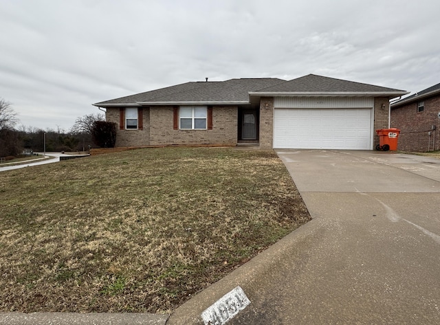 ranch-style home featuring a front yard and a garage