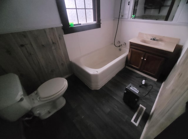 bathroom featuring hardwood / wood-style flooring, vanity, and toilet