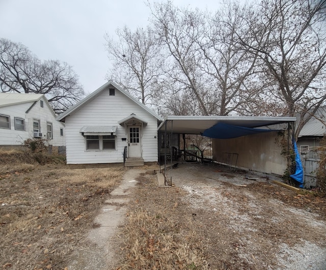 view of front of home with a carport