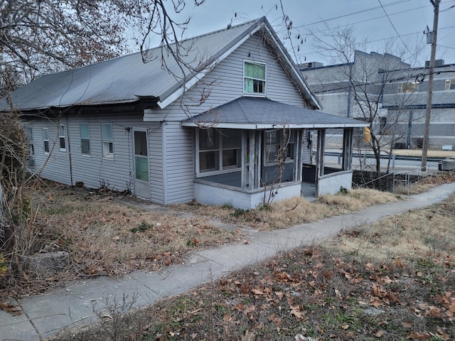 view of front of property with a sunroom