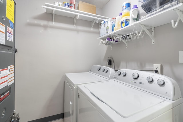 clothes washing area with washing machine and clothes dryer