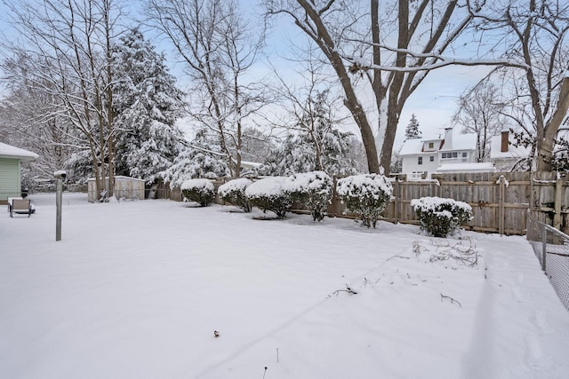 view of yard covered in snow