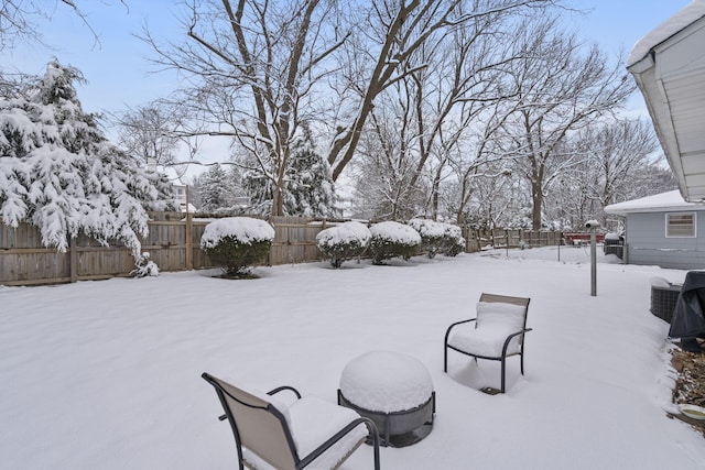 view of yard layered in snow