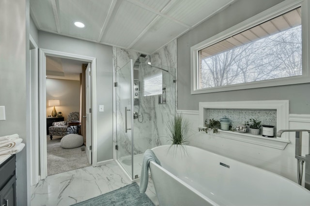 bathroom with vanity, separate shower and tub, and plenty of natural light