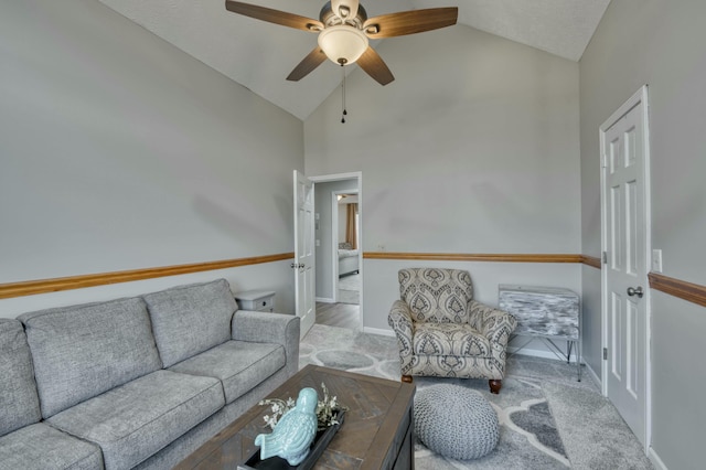 living room with ceiling fan and lofted ceiling