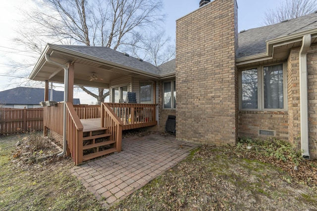 rear view of property featuring a patio area, ceiling fan, and a deck