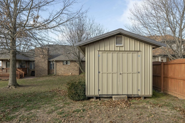 view of outbuilding with a yard