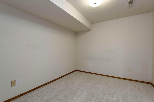 empty room with light colored carpet