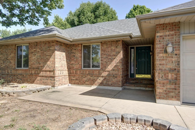 doorway to property with a patio area