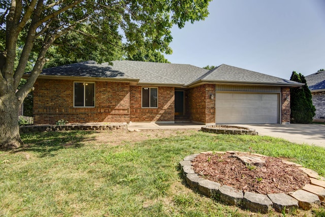 ranch-style home featuring a garage and a front lawn