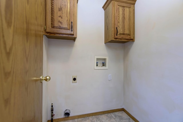 laundry area featuring cabinets, washer hookup, electric dryer hookup, and light tile patterned flooring