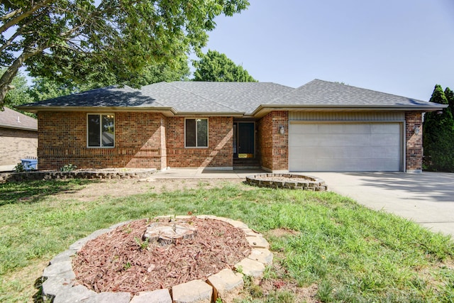 ranch-style home featuring a front lawn and a garage