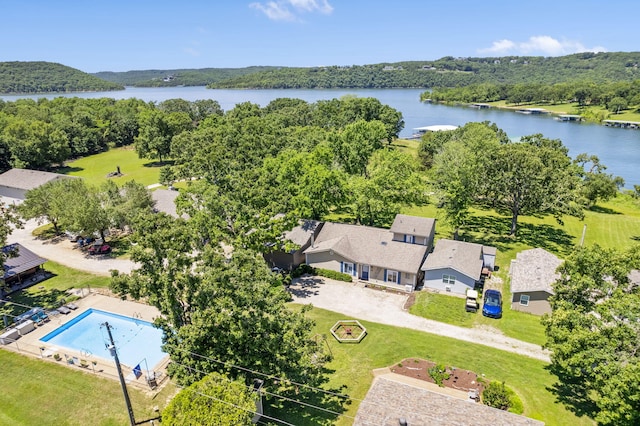 birds eye view of property with a water view