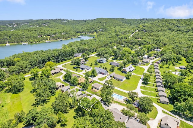 bird's eye view featuring a water view, a wooded view, and a residential view