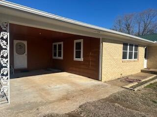 view of property exterior featuring a carport