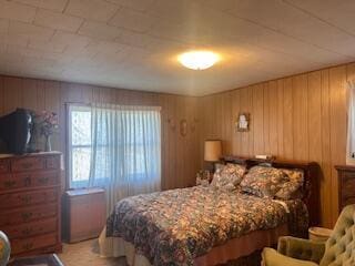 bedroom with wooden walls